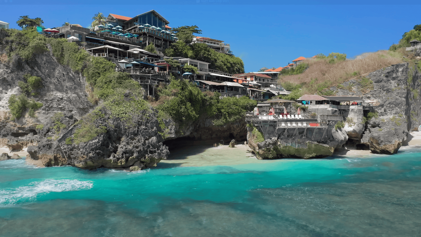 Suluban Beach is surrounded by cliffs and hotels. 