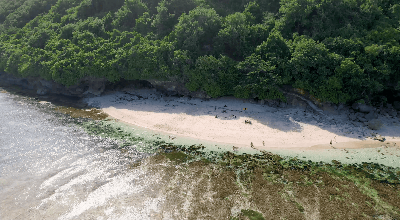 The temple and surf spot Green Bowl beach in the south of Bali. Aerial shots during day light.