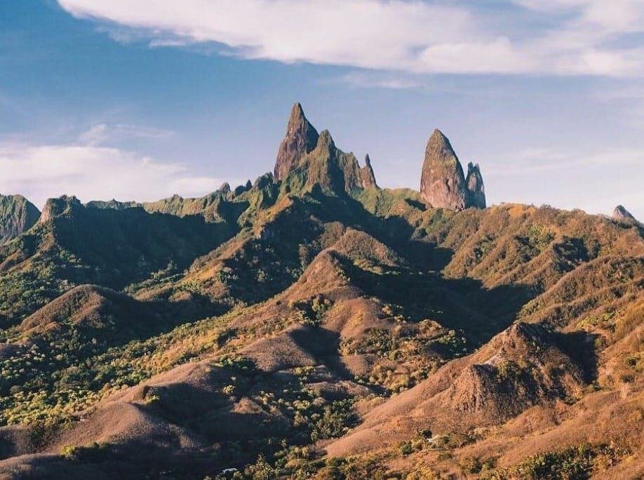 The Ua Pou mountain range with trees and bushes