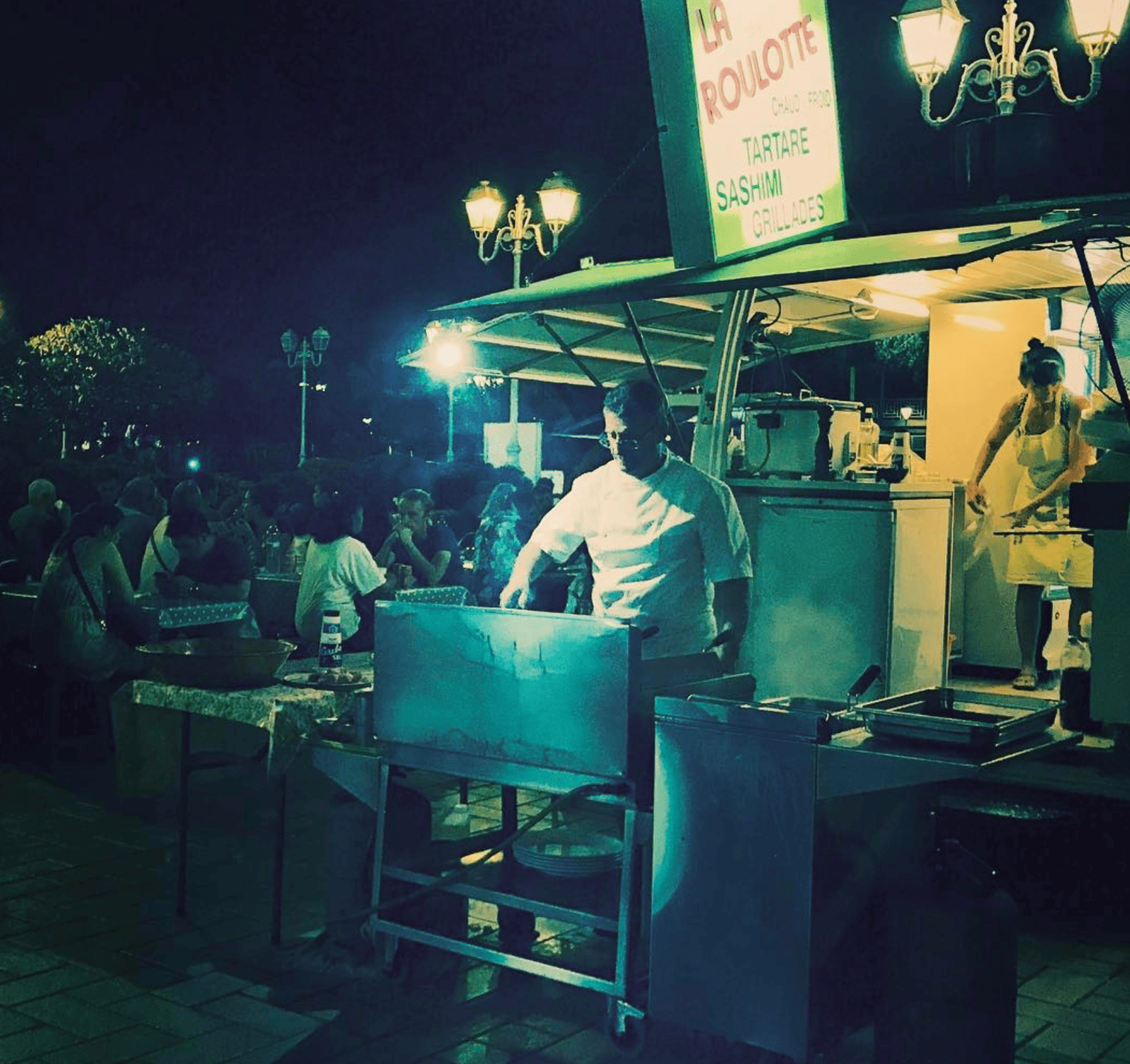 A food truck with a stand in Tahiti.