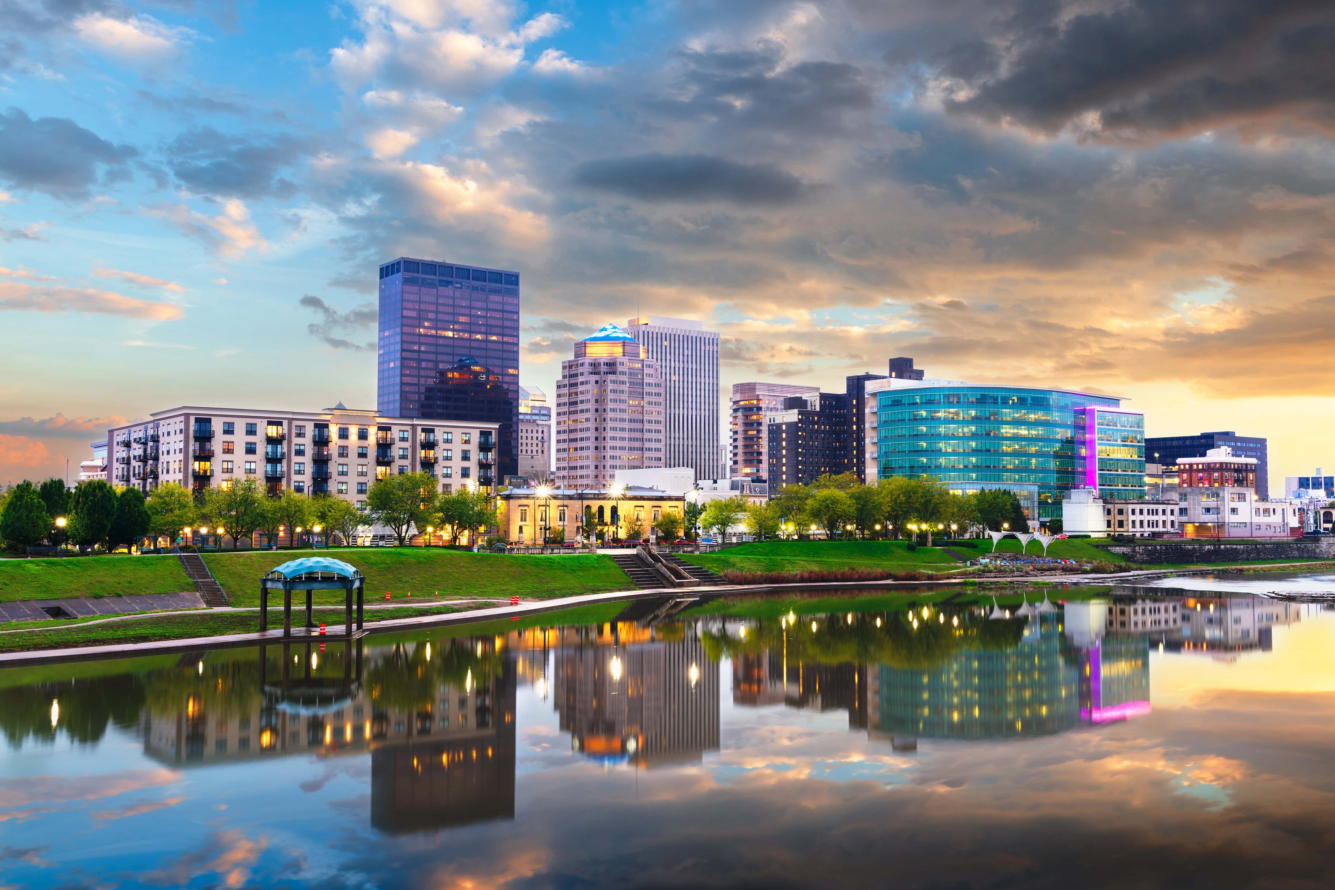 Dayton, Ohio, USA downtown cityscape on the Miami River at dusk.