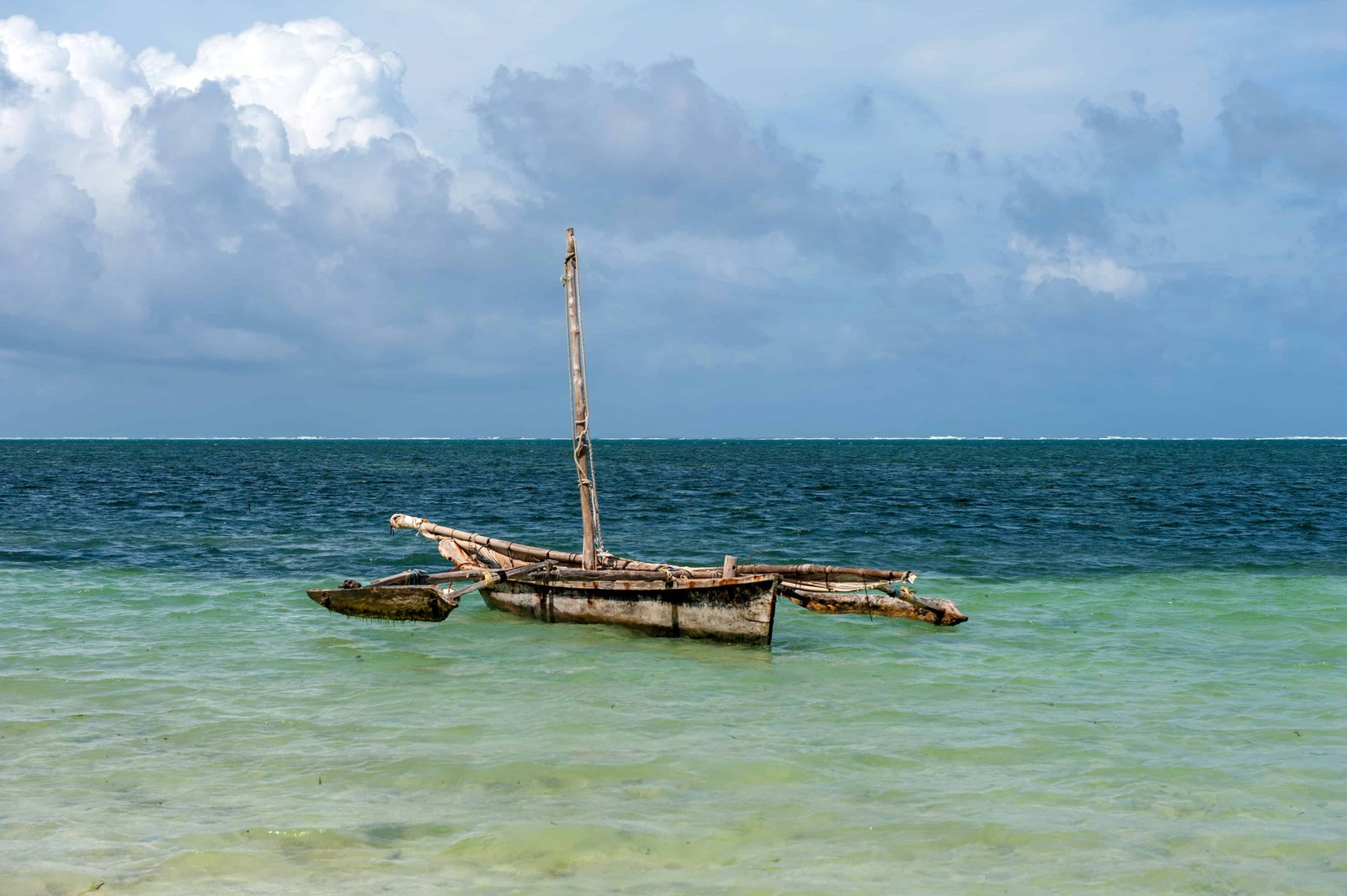 Old wooden dhow, fishing boats in the ocean. Kenya, Africa