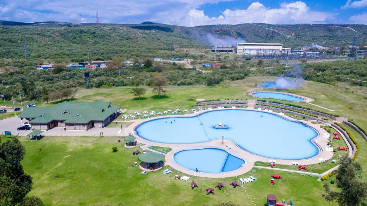 Relaxing outdoor swimming pools at Lost Between Oceans with lush green surroundings and scenic mountain views. Perfect for family fun and leisure.